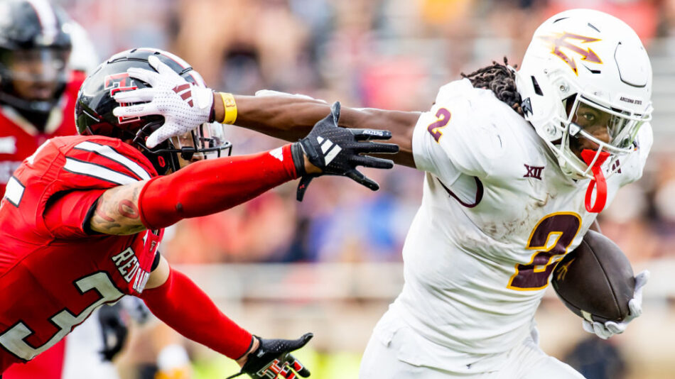 Kyson Brown #2 of the Arizona State Sun Devils attempts to hold off Miquel Dingle Jr. #35 of the Te...