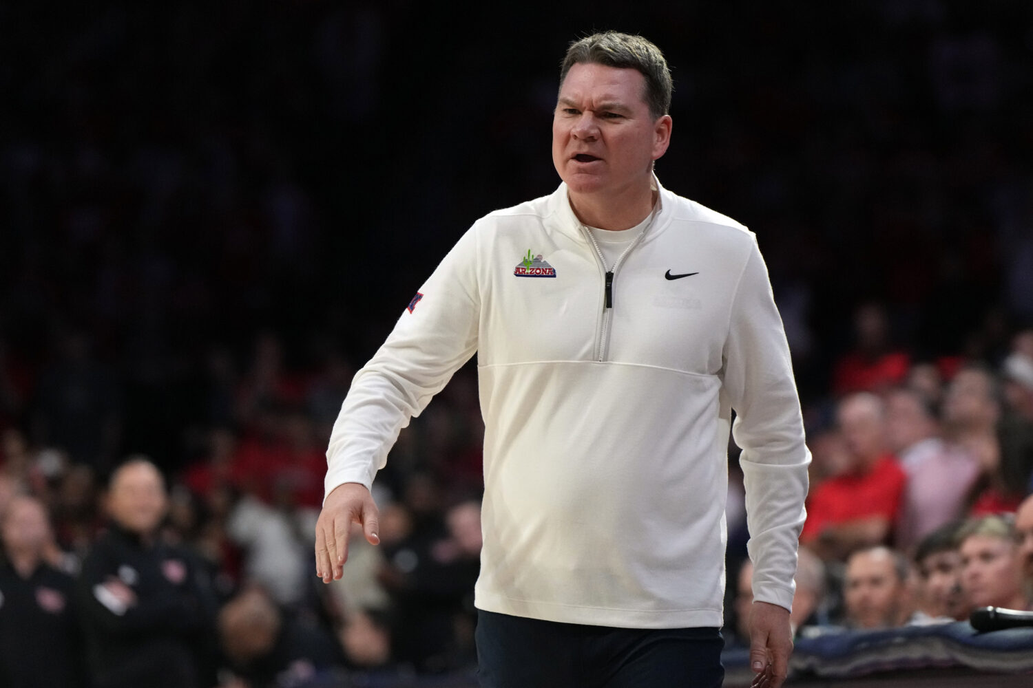 Arizona head coach Tommy Lloyd reacts after a foul call against Texas Tech during the first half of...