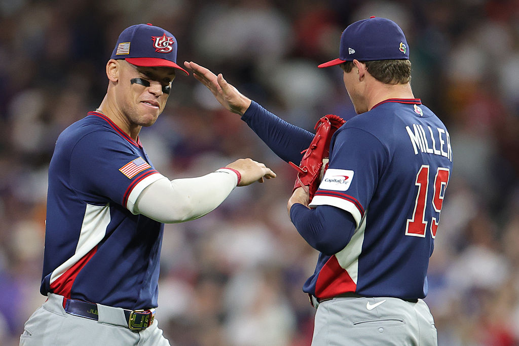 HOUSTON, TEXAS - MARCH 13: Mason Miller #19 and Aaron Judge #99 of Team United States celebrate the...
