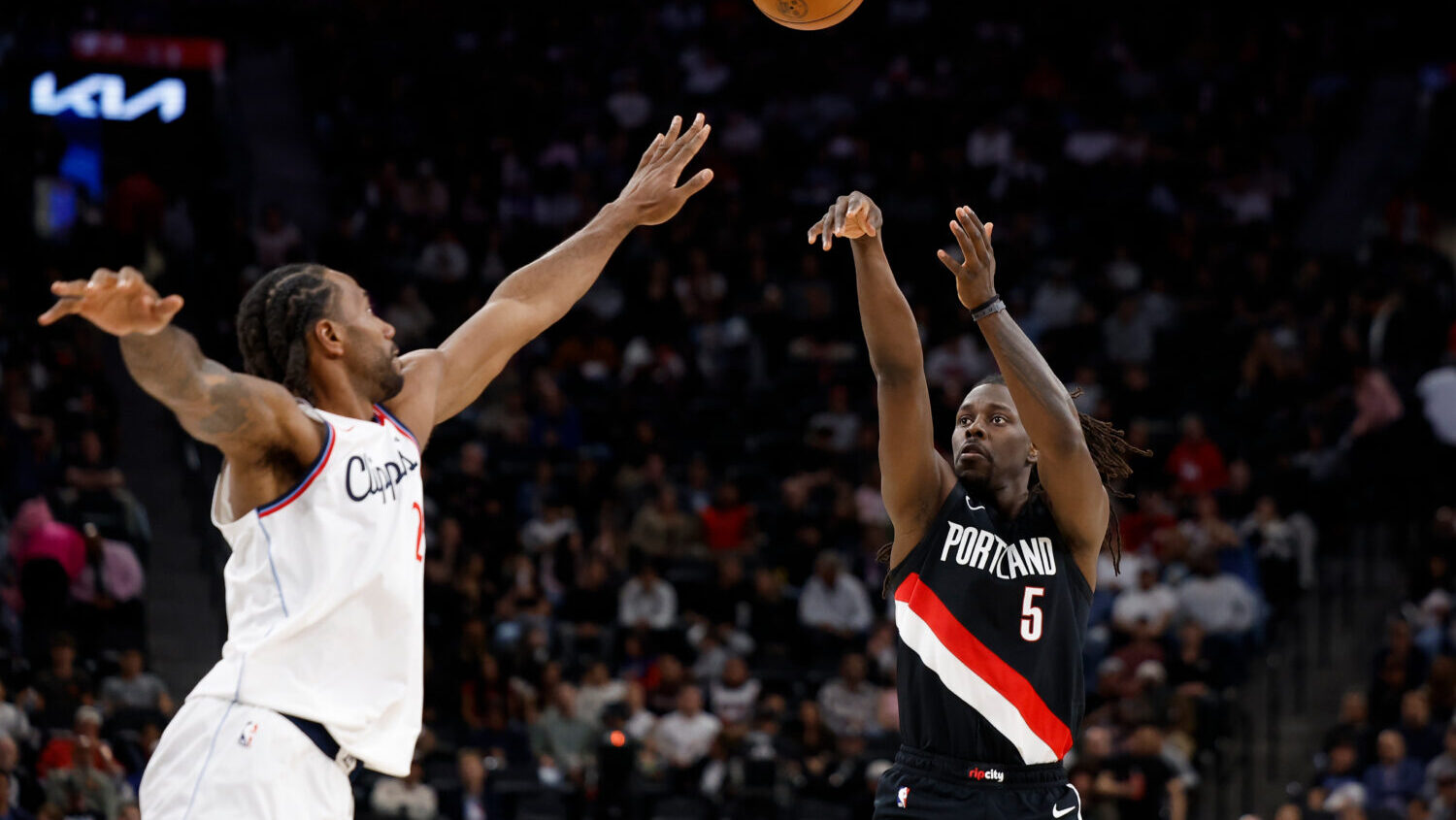 Portland Trail Blazers guard Jrue Holiday (5) shoots the ball while being guarded by LA Clippers fo...