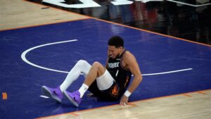 Devin Booker limped to locker room after tripping on Lu Dort, returns in playoff game