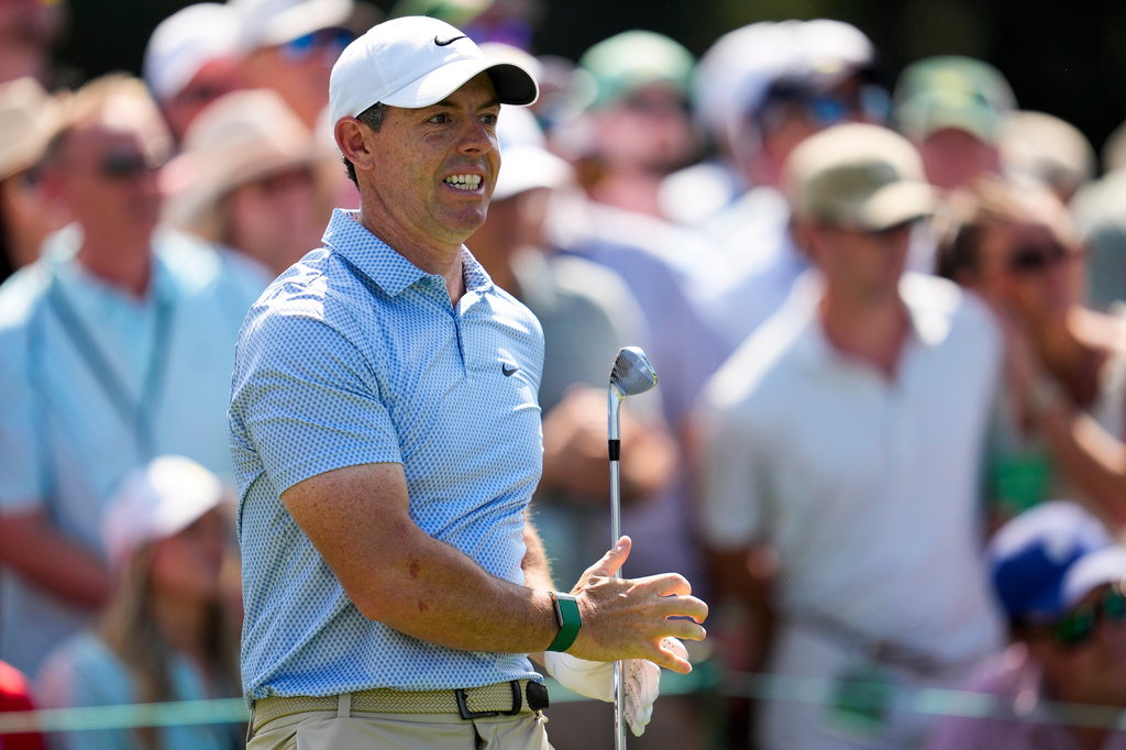 Rory McIlroy, of Northern Ireland, watches his tee shot on the sixth hole during the final round of...