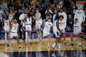 UConn reaches 3rd national title game in 4 seasons, beating Illinois 71-62 behind Mullins and Reed