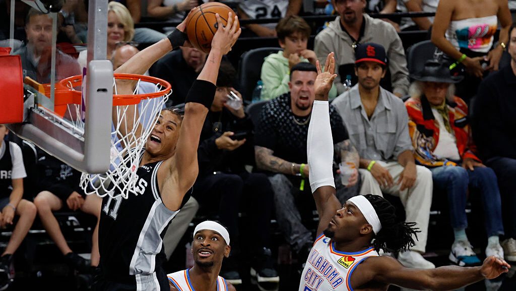 SAN ANTONIO, TEXAS - MAY 28: Carter Bryant #11 of the San Antonio Spurs drives to the rim as Luguen...