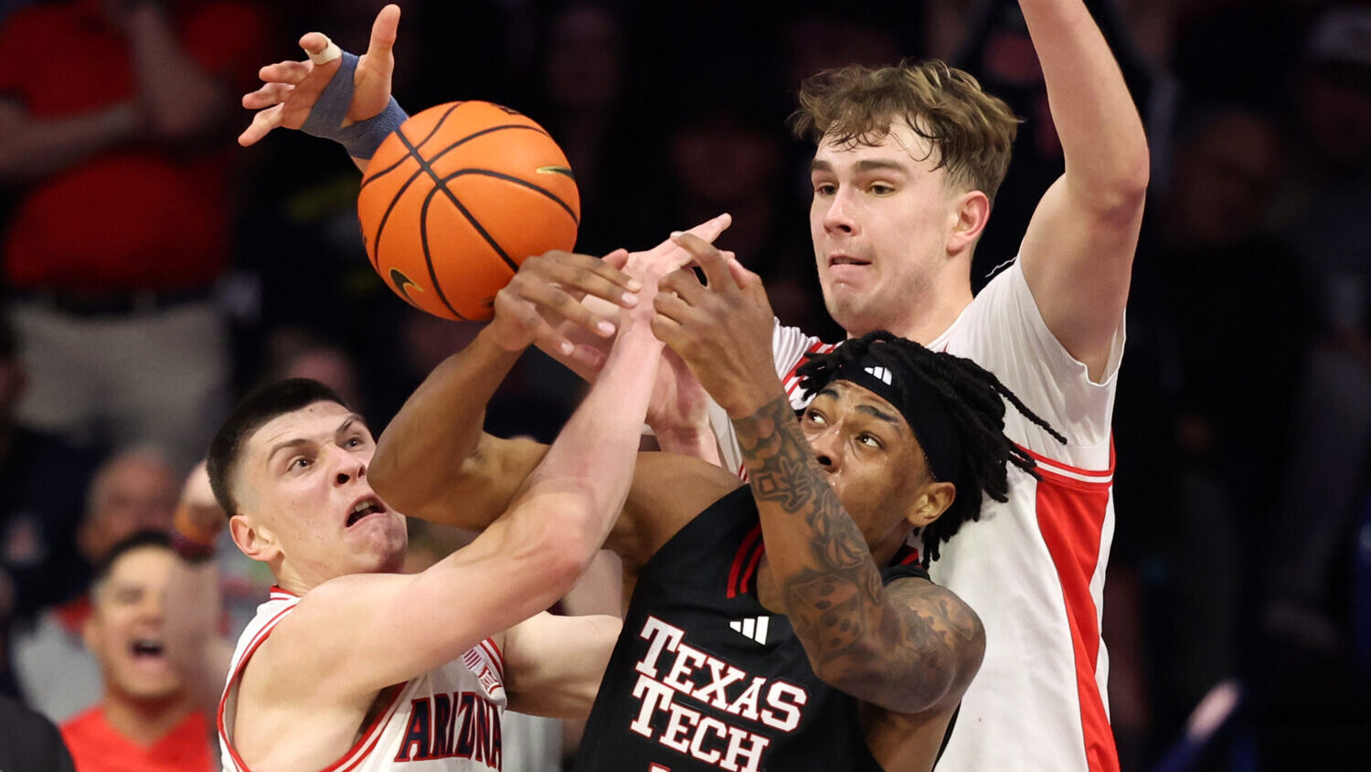 TUCSON, ARIZONA - FEBRUARY 14: Ivan Kharchenkov #8 and Motiejus Krivas #13 of the Arizona Wildcats ...