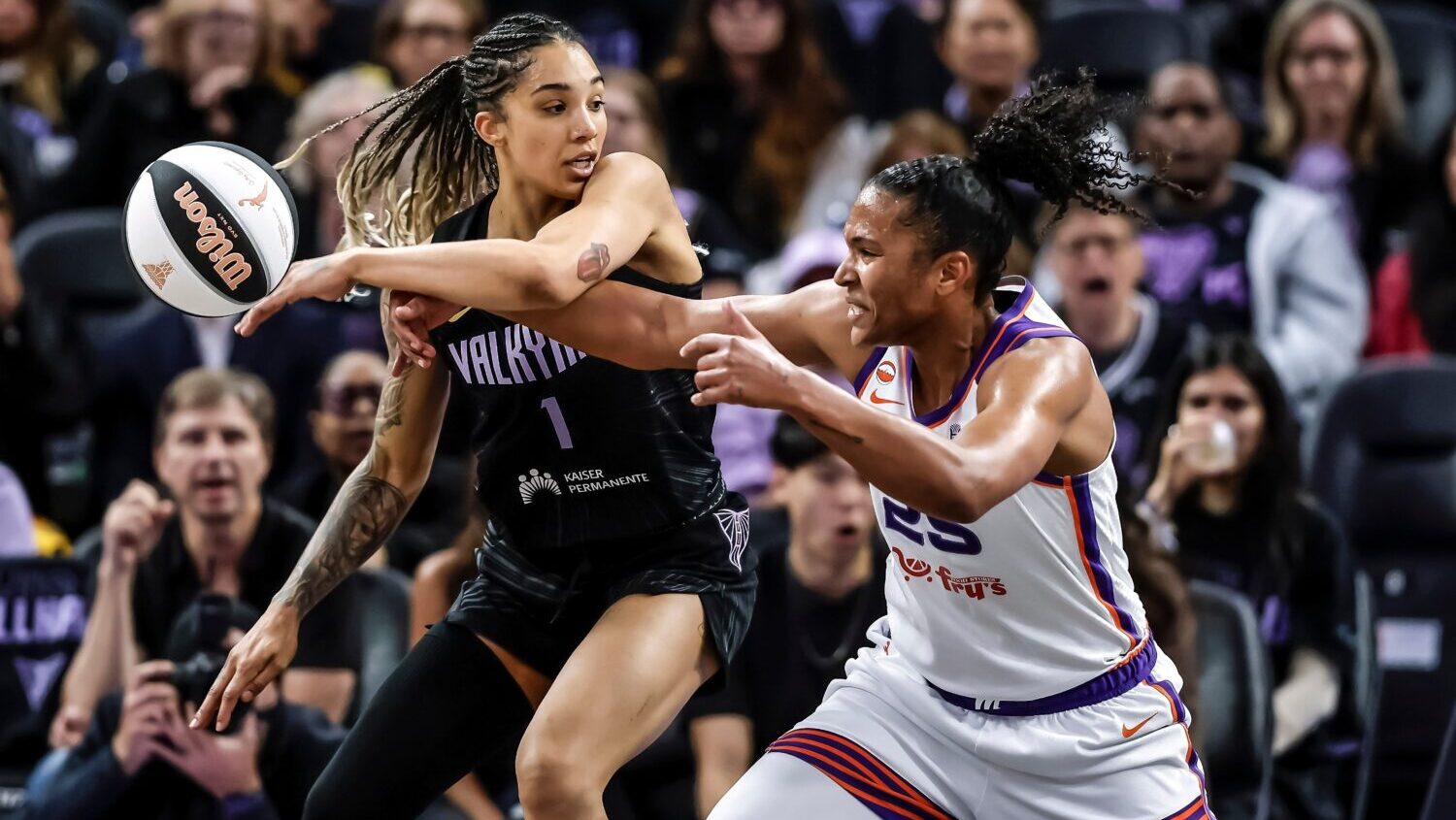 Phoenix Mercury forward Alyssa Thomas (25) strips the ball from Dallas Wings guard Arike Ogunbowale...