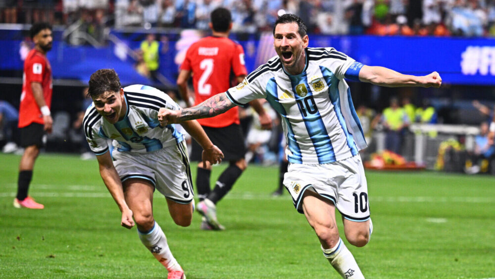 Argentina's Lionel Messi (10) celebrates scoring their second goal during the World Cup round of 16...