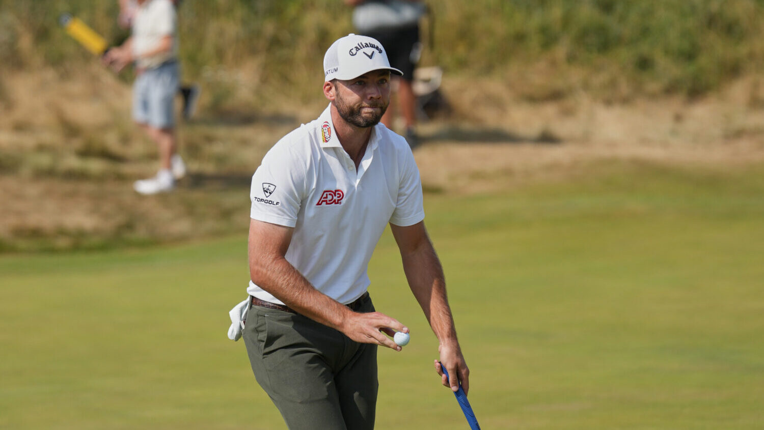 Sam Burns of the United States reacts after making a birdie on the 2nd green during the third day o...