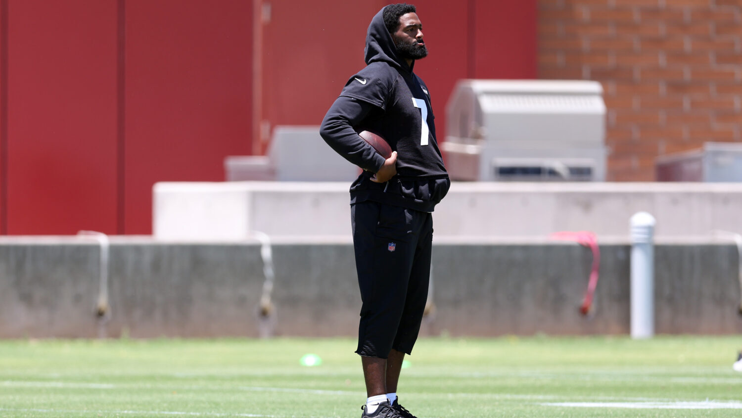 TEMPE, ARIZONA - JUNE 09: Jacoby Brissett #7 of the Arizona Cardinals looks on during the mandatory...