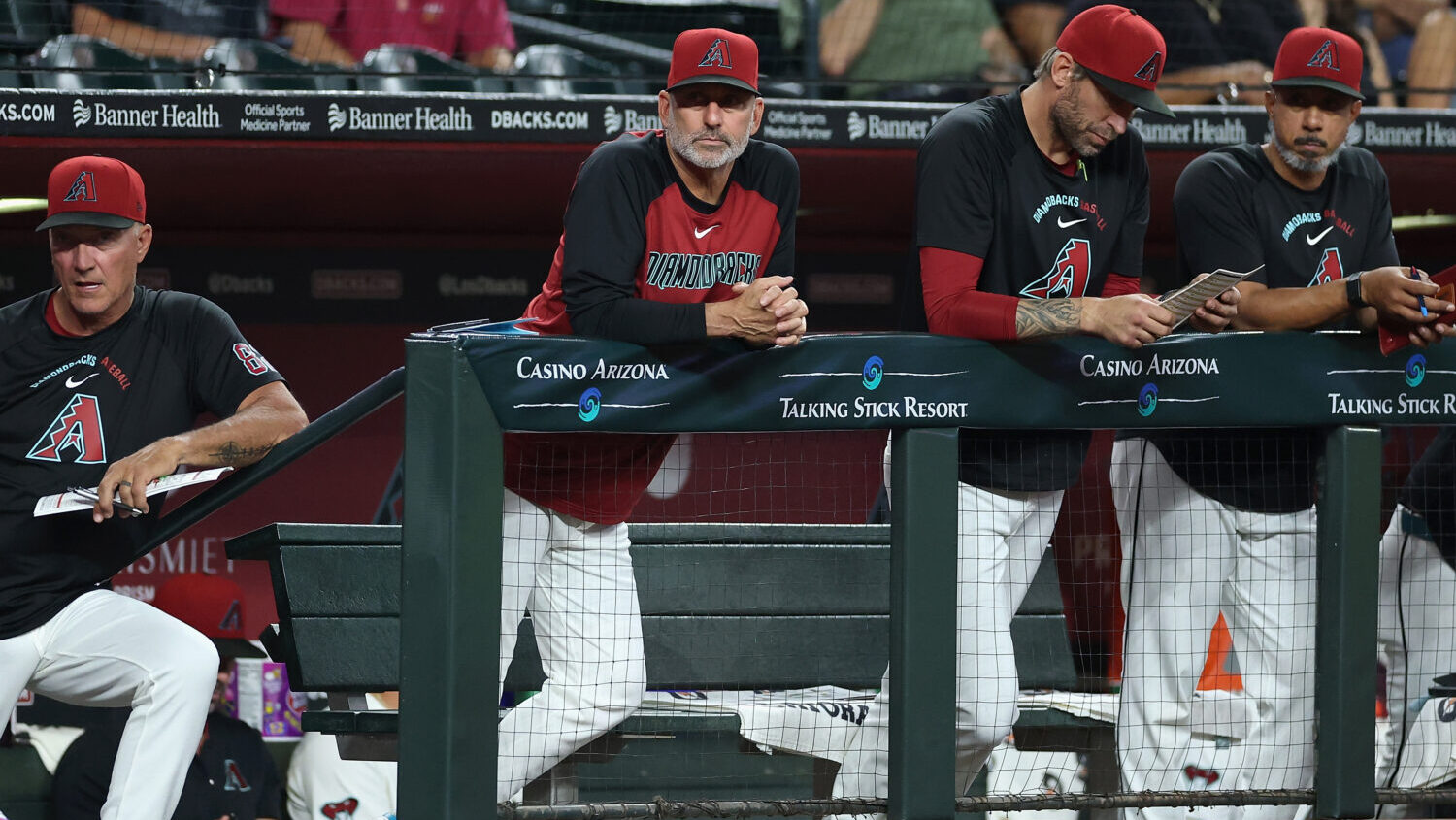 PHOENIX, ARIZONA - JUNE 30: Manager Torey Lovullo #17 of the Arizona Diamondbacks watches from the ...