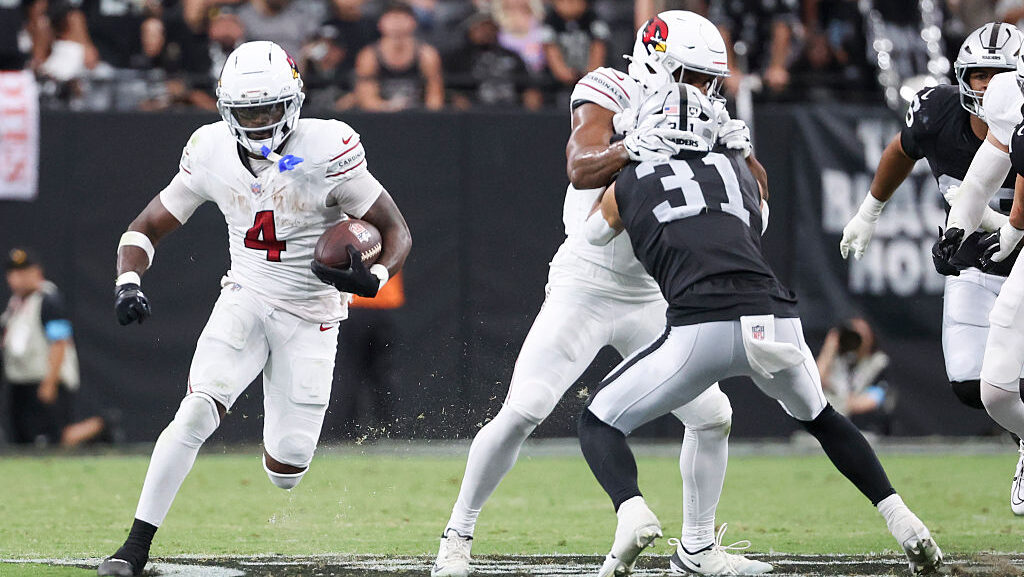 Jeremiyah Love running through tackles during Arizona Cardinals preseason game