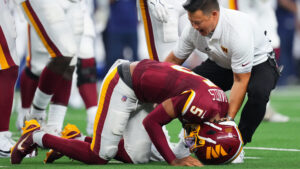 Jayden Daniels dislocates left elbow for second time in less than a year