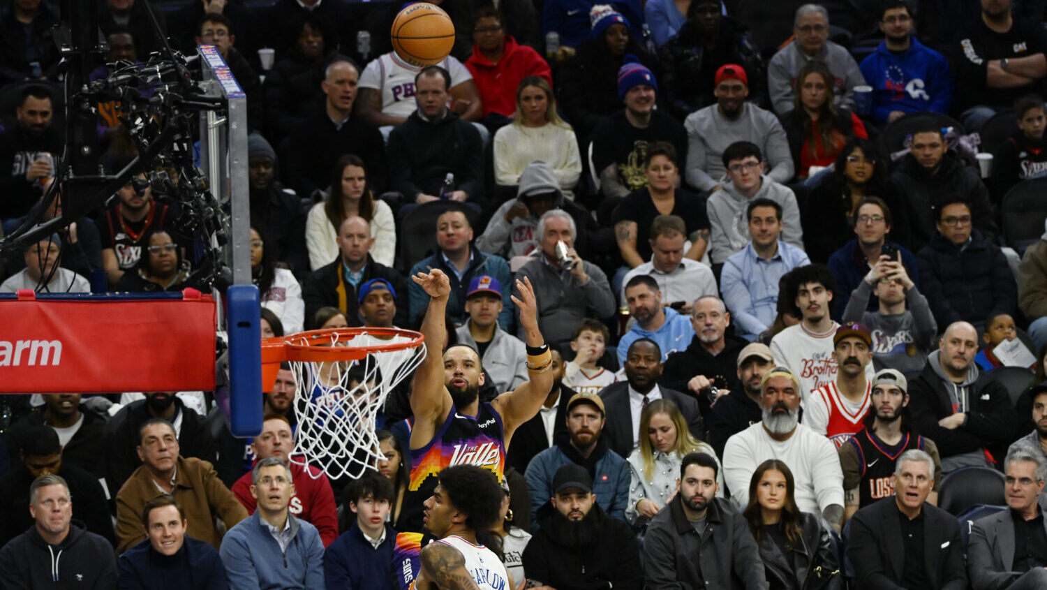 Dillon Brooks #3 of the Phoenix Suns shoots a three pointer against Dominick Barlow #25 of the Phil...