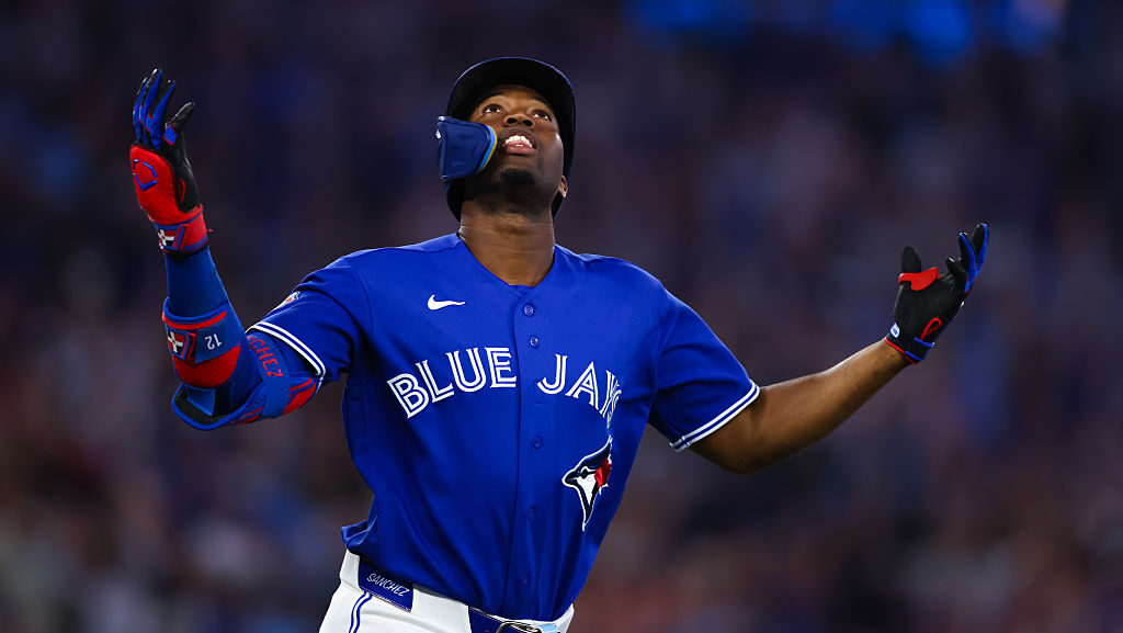 Jesús Sánchez #12 of the Toronto Blue Jays reacts after hitting a grand slam home run in the sixt...