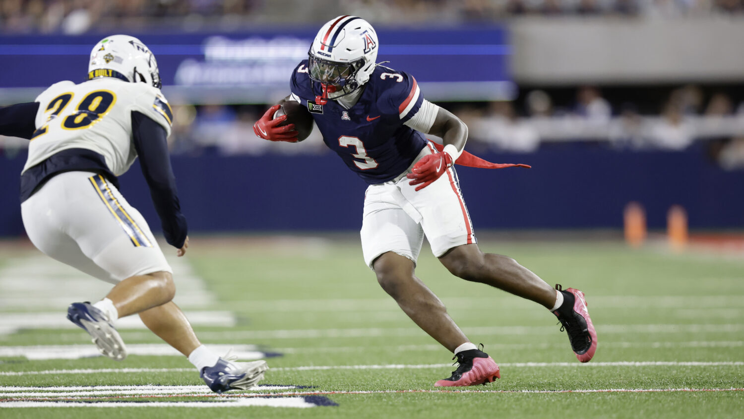 Arizona Wildcats running back Kedrick Reescano (3) runs with the ball during the first half of a fo...