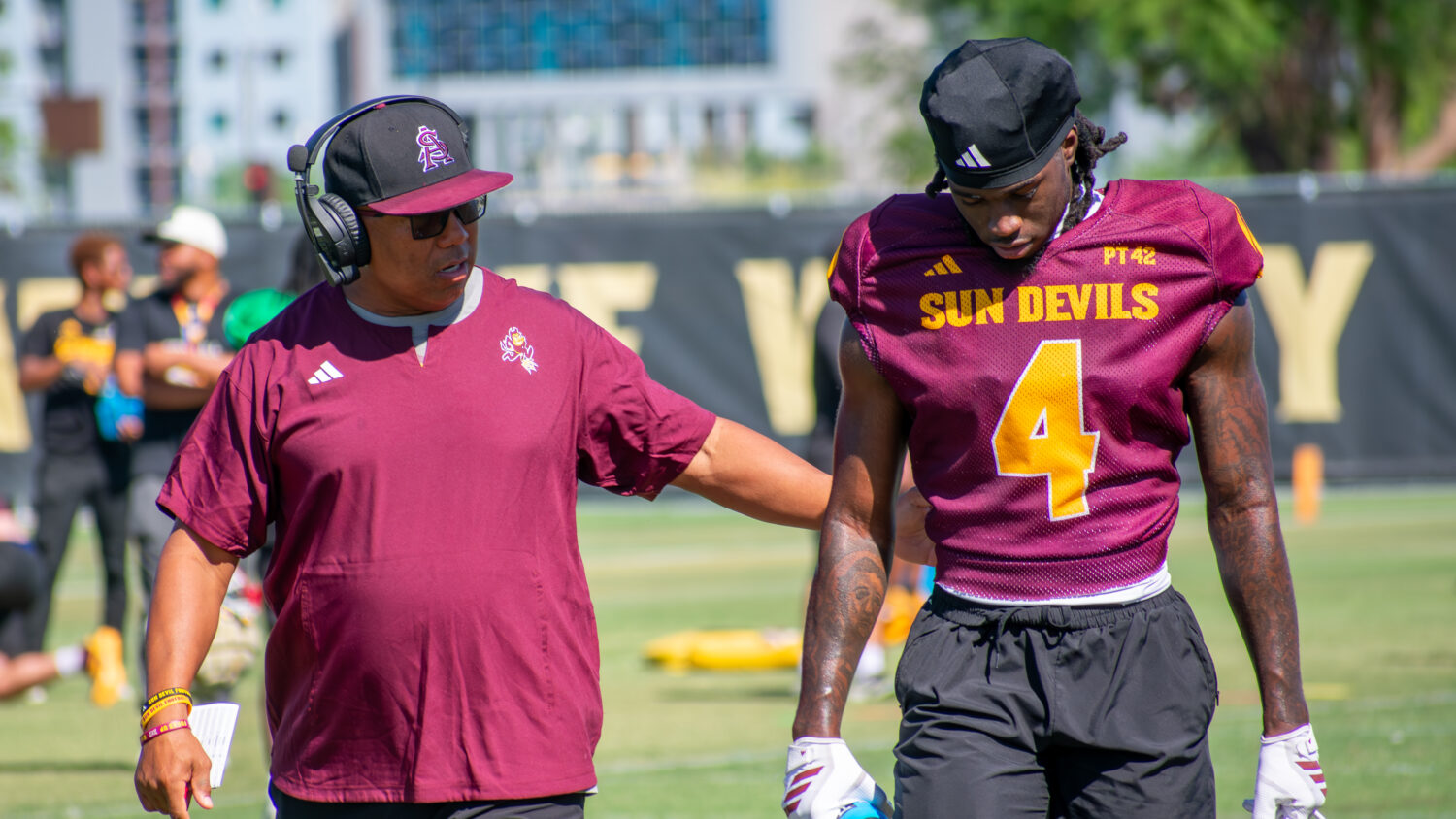 Arizona State wide receivers coach Hines Ward with WR Omarion Miller at practice on March 26, 2026....