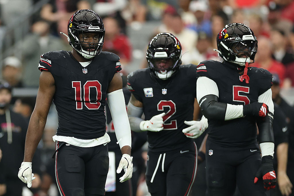 GLENDALE, ARIZONA - OCTOBER 05: Josh Sweat #10 (R) of the Arizona Cardinals during the NFL game at ...
