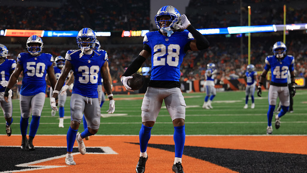 Keith Abney II #28 of the Detroit Lions celebrates recovering a fumble with teammates....