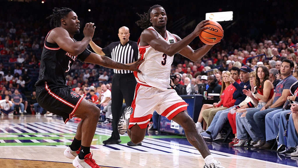 TUCSON, ARIZONA - OCTOBER 16: Caleb Holt #3 of the Arizona Wildcats dribbles the ball against Latre...