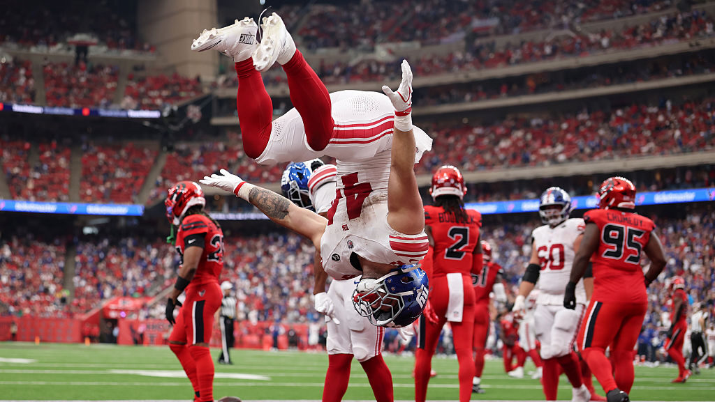 HOUSTON, TEXAS - OCTOBER 25: Cam Skattebo #44 of the New York Giants celebrates a touchdown during ...