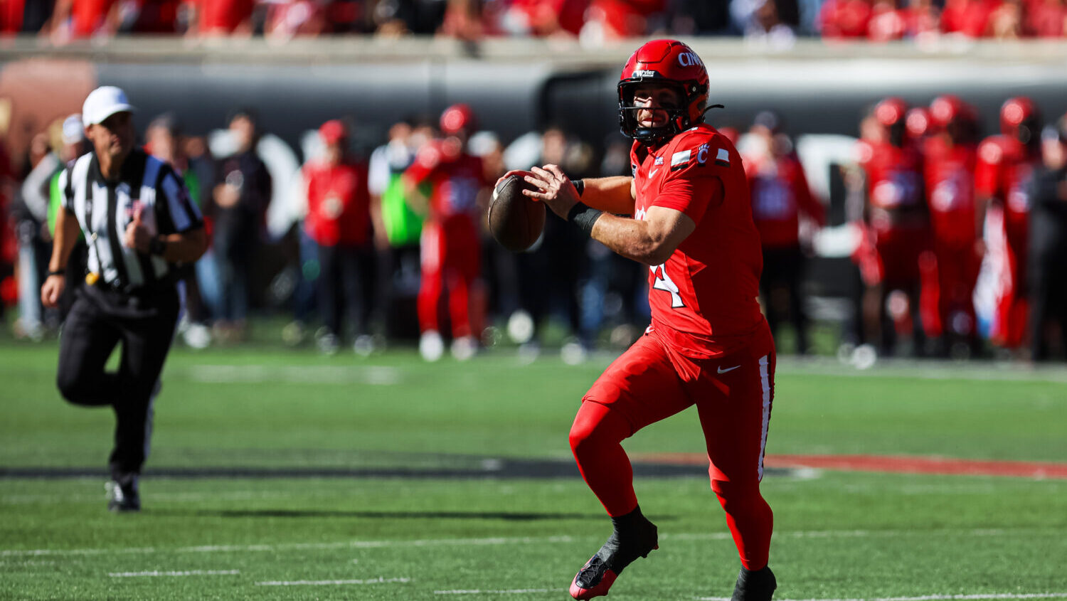 Cincinnati quarterback JC French IV throws a pass during the first half of an NCAA college football...