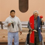 Travis Majenty, left, and Emmet Bender, right, both of the Hualapai Nation, perform a blessing at the rollout for the Skywalk on the Hualapai 
Indian Reservation in Grand Canyon West, Ariz., Wednesday, March 7, 2007. (Associated Press)