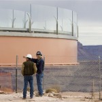 Construction crew members help guide the glass-bottomed Skywalk over the edge of the west rim of the Grand Canyon on Wednesday, March 7, 2007. (Associated Press)
