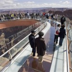 Tourists walk on the glass-bottomed Skywalk that extends 70 feet over the 
edge of Grand Canyon West's Eagle Point, Wednesday, March 28, 2007, in 
northwestern Arizona. The Grand Canyon Skywalk opened to the general public 
on the Hualapai Indian Reservation. (AP Photo/The Arizona Republic, Rob 
Schumacher)