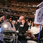 Oakland Raiders draft representatives work the phones before the NFL Draft Saturday at Radio City Music Hall in New York. The Raiders selected LSU quarterback JaMarcus Russell with the No.1 overall pick. AP Photo/Jason DeCrow