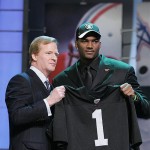 JaMarcus Russell, a quarterback from Louisiana State, stands with NFL commissioner Roger Goodell after being selected by the Oakland Raiders as the No. 1 overall pick. AP Photo/Stephen Chernin