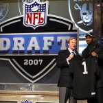 JaMarcus Russell, a quarterback from Louisiana State, stands with NFL commissioner Roger Goodell after being selected by the Oakland Raiders as the No. 1 overall pick. AP Photo/Jason DeCrow