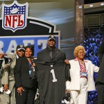 JaMarcus Russell, a quarterback from Louisiana State, stands with family members after being selected by the Oakland Raiders as the No. 1 overall pick. AP Photo/Jason DeCrow