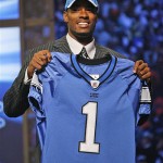 Calvin Johnson, a wide receiver from Georgia Tech, holds a jersey after being selected second overall by the Detroit Lions during first round. AP Photo/Jason DeCrow