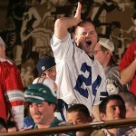 A Dallas Cowboys fan taunts a Miami Dolphins fan after Miami made their selection during first round of the NFL Draft Saturday. AP Photo/Frank Franklin II
