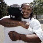 California running back Marshawn Lynch hugs a friend at his former high school, Oakland Technical High School, in Oakland, Calif., Saturday after he was picked by the Buffalo Bills as the No. 12 pick overall in the NFL football draft. AP Photo/Paul Sakuma
