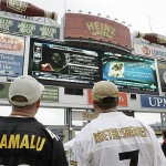 Pittsburgh Steelers fans Mike Brothers nd Bill Atkins watch the big screen at Heinz Field during the team's annual fan blitz on NFL draft day in Pittsburgh, Saturday. AP Photo/Keith Srakocic