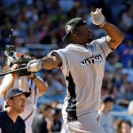 New York Giants defensive end Justin Tuck watches his hit to the outfield during the All-Star Legends & Celebrity softball game at Yankee Stadium in New York, Sunday.