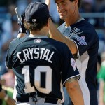 Comedian Billy Crystal greets All Star Legend Paul O'Neill at the plate after O'Neill hit a solo home run in the bottom of the first inning in the All Star Legends & Celebrity softball game at Yankee Stadium in New York, Sunday.