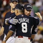 Texas Rangers' Josh Hamilton, right, embraces Clay Council, a volunteer coach for an American Legion team in Cary, N.C., as Minnesota Twins' Justin Moreau looks on after the Major League Baseball All-Star Home Run Derby at Yankee Stadium in New York on Monday.