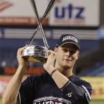Minnesota Twins' Justin Morneau poses with the trophy after winning baseball's All-Star Home Run Derby at Yankee Stadium in New York on Monday.