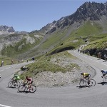 The pack with Frank Schleck of Luxemburg, wearing the overall leader's yellow jersey, speeds down Galibier pass during the 17th stage of the Tour de France cycling race between Embrun and l'Alpe-d'Huez, French Alps, Wednesday.