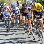 Frank Schleck of Luxemburg, right, looks back to see if Cadel Evans of Australia, behind him, who can follow his acceleration as he climbs towards l'Alpe-d'Huez during the 17th stage of the Tour de France cycling race between Embrun and l'Alpe-d'Huez, French Alps, Wednesday.