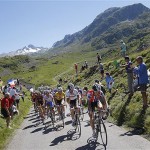 Kurt-Asle Arvesen of Norway, Fabian Cancellara of Switzerland, Frank Schleck of Luxemburg, wearing the overall leader's yellow jersey, and Bernhard Kohl of Austria, wearing the best climber's dotted jersey, seen from front to rear, lead the pack as they climb Croix de Fer pass during the 17th stage of the Tour de France cycling race between Embrun and l'Alpe-d'Huez, French Alps, Wednesday.