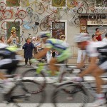 The pack passes a restaurant adorned with colored bicycles on the outskirts of Roanne during the 19th stage of the Tour de France cycling race between Roanne and Montlucon, central France, Friday.