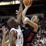 Canada guard Carl English, right, takes a shot against United States guard Michael Redd, left, during a basketball game at the Thomas & Mack Center in Las Vegas, Friday, July 25, 2008. (AP Photo/Louie Traub)