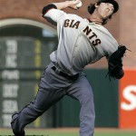San Francisco Giants starting pitcher Tim Lincecum throws against the Arizona Diamondbacks in the first inning of their baseball game in San Francisco, Saturday, July 26, 2008. (AP Photo/Eric Risberg)