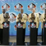 From left, Darrell Green, Emmitt Thomas, Art Monk, Gary Zimmerman, Andre Tippett and Fred Dean stand next to their bronze busts at the Pro Football Hall of Fame on Saturday, Aug. 2, 2008 in Canton, Ohio. (AP Photo/Kiichiro Sato)