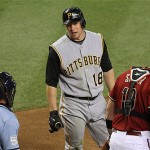 Pittsburgh Pirates' Jason Michaels (18) talks with umpire Greg Gibson, left, after being called out on strikes against the Arizona Diamondbacks in the second inning of a baseball game Tuesday, Aug. 5, 2008, in Phoenix. Diamondbacks' Chris Snyder, right, awaits the next batter. (AP Photo/Ross D. Franklin)