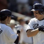 San Diego Padres' Nick Hundley celebrates with teammate Sean Kazmar after Hundley's two-run home run against the Arizona Diamondbacks in the seventh inning of the Padres 5-4 victory in a baseball game, Wednesday, Aug. 27, 2008 in San Diego. (AP Photo/Lenny Ignelzi)