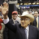 Former Secretary of State Henry Kissinger waves while wearing a cowboy hat loaned to him by a Texas Delegate at the Republican National Convention in St. Paul, Minn., Thursday, Sept. 4, 2008. (AP Photo/Charles Rex Arbogast)